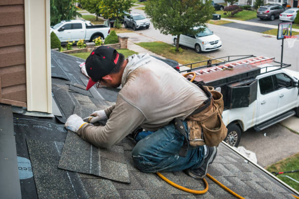 Professional Roofing technician working in Centerport, NY